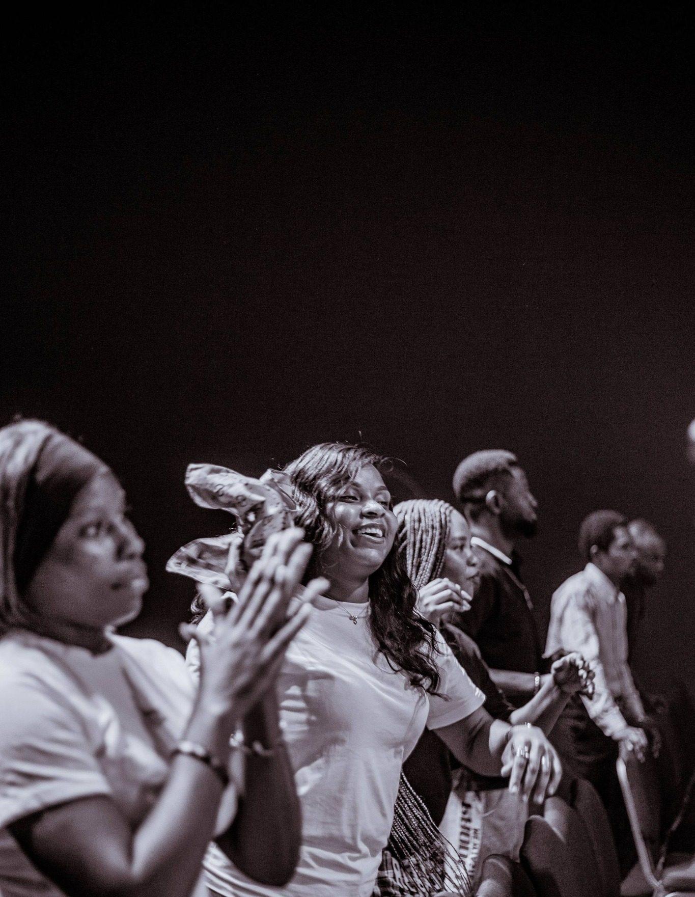 A worshipper with hands raised